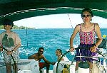 Stina and Rachelle working the helm aboard Spica Star (John Beck).